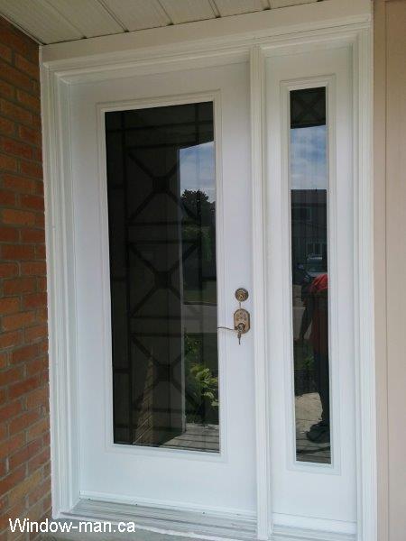 Single steel insulated front entry door and one sidelight. Contemporary Century wrought iron glass inserts